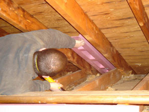 attic baffle being installed image